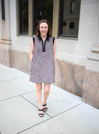 Sleeveless animal print dress with zipper neckline and black shoulder details