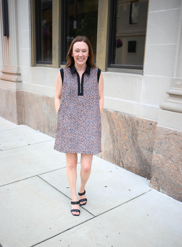 Sleeveless animal print dress with zipper neckline and black shoulder details