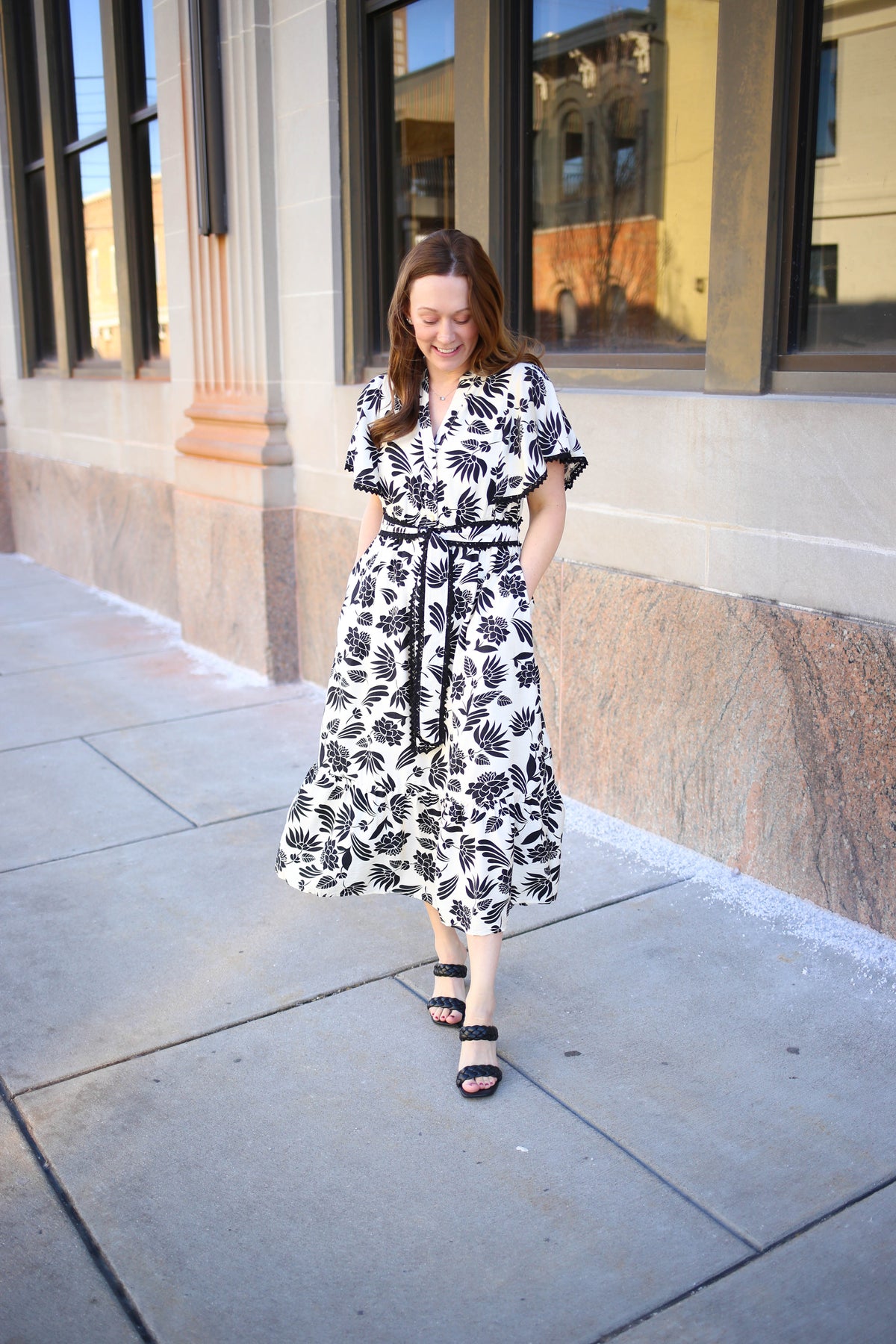 White and black floral print midi dress with scalloped hem details