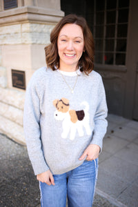 heather grey sweater with fuzzy brown black and white dog on the front