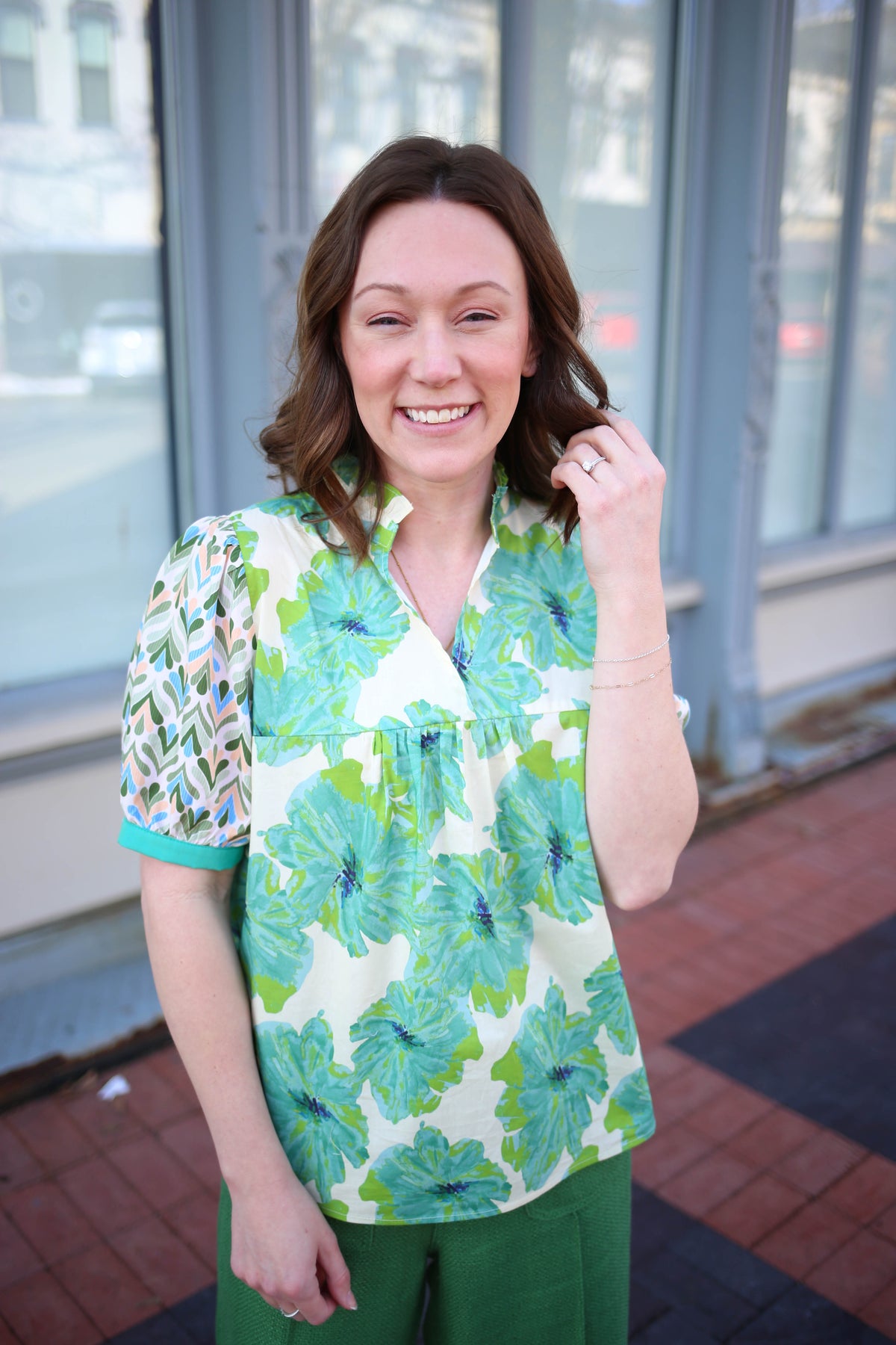 Green and blue floral print blouse with mixed print short sleeves