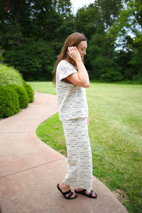 side view of the off white and black textured pant