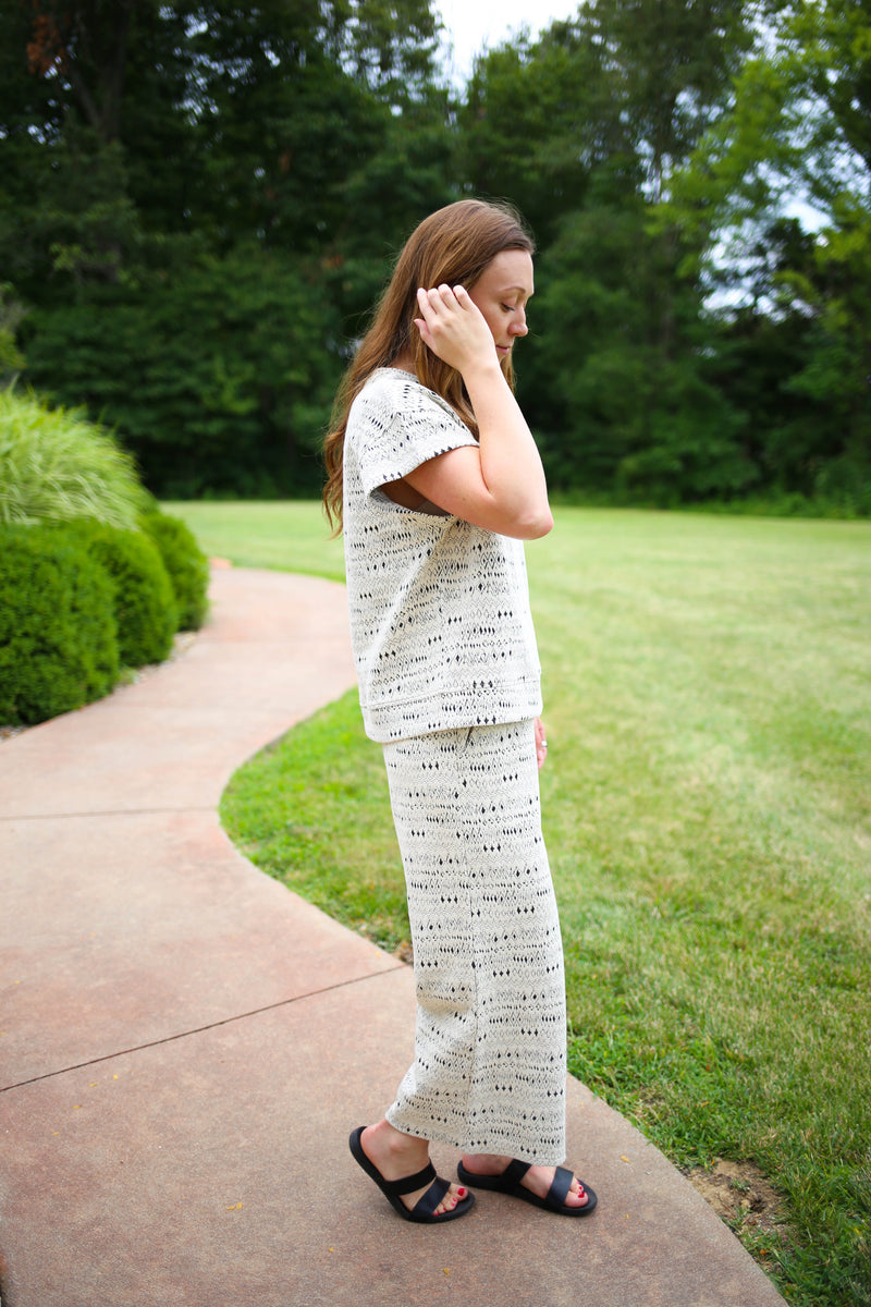 side view of the off white and black textured pant