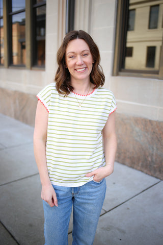 Green and white stripe short sleeve top with orange hemline details