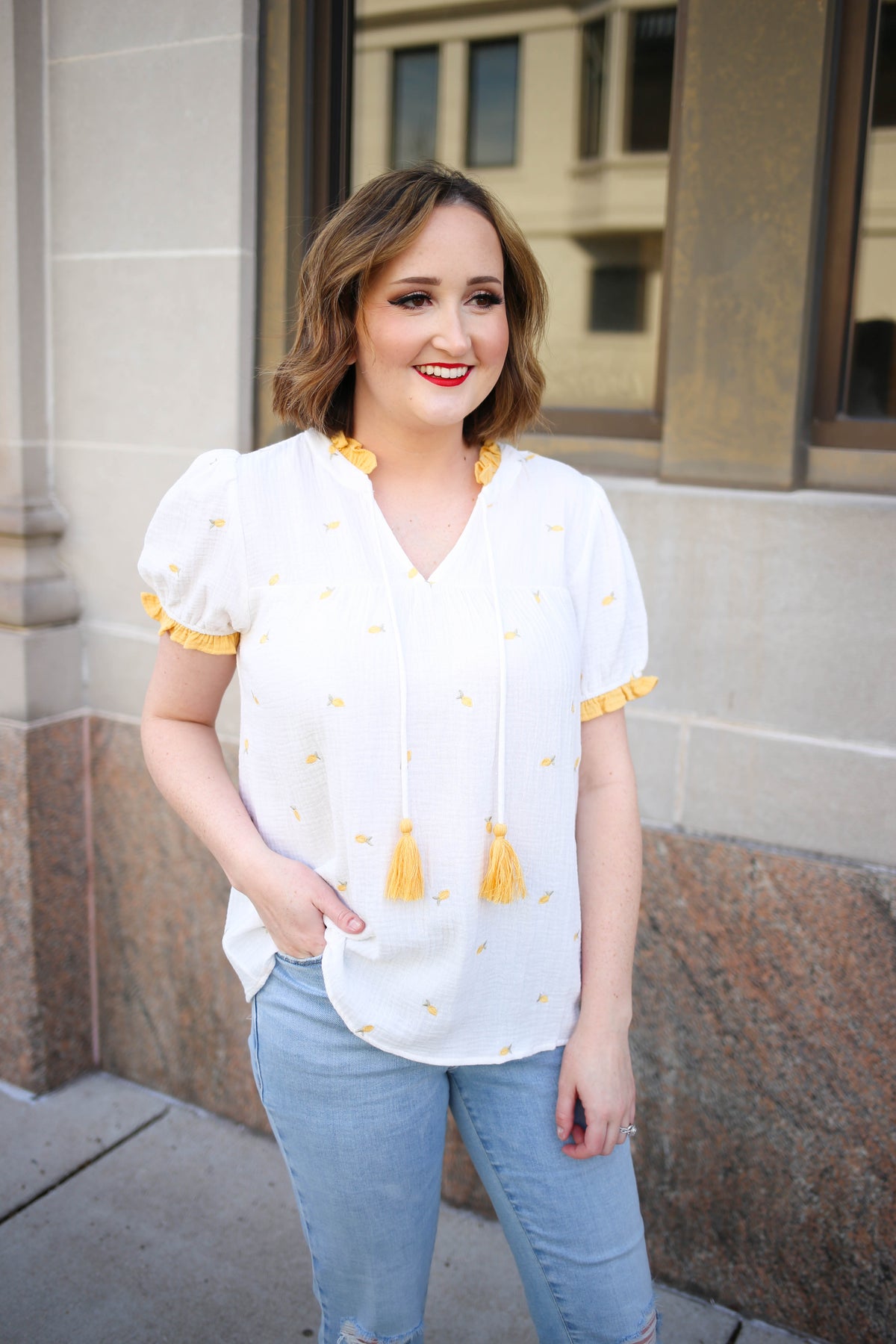 White and yellow short sleeve top with lemon embroidery details