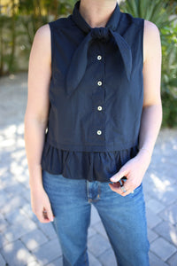 Sleeveless Black Top with Tie Neckline Detail and Ruffle Hemline