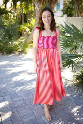 Red pink and orange stripe midi dress with scallop hem details and tie spaghetti straps