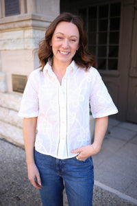 off-white short sleeve top with collar and floral crochet applique 