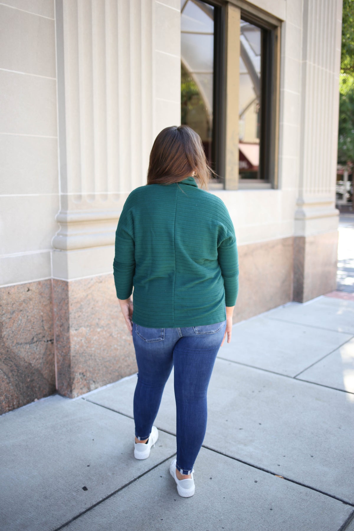 back detail of the hunter green ribbed knit cowl neck top