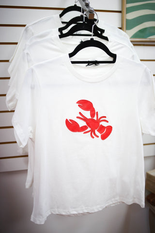 white short sleeve top with red lobster detail