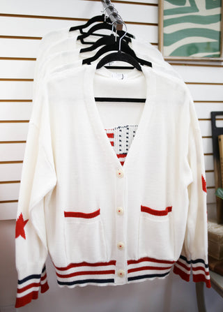 off-white cardigan with American flag on back
