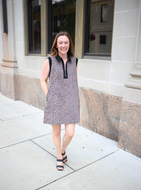brown animal print dress with zipper neckline and black shoulder details