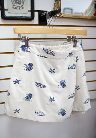Linen skort with navy ocean theme embroidery detail