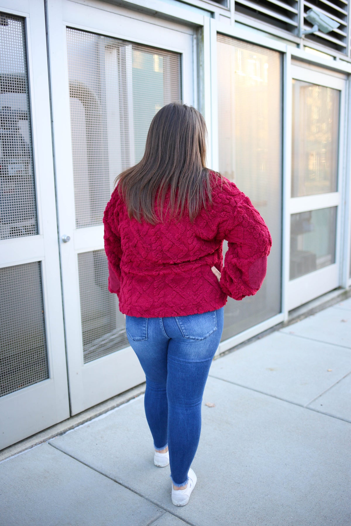 back of the burgundy sherpa half-zip sweatshirt