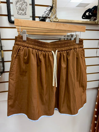 Brown athleisure skort with blue hem and elastic waist